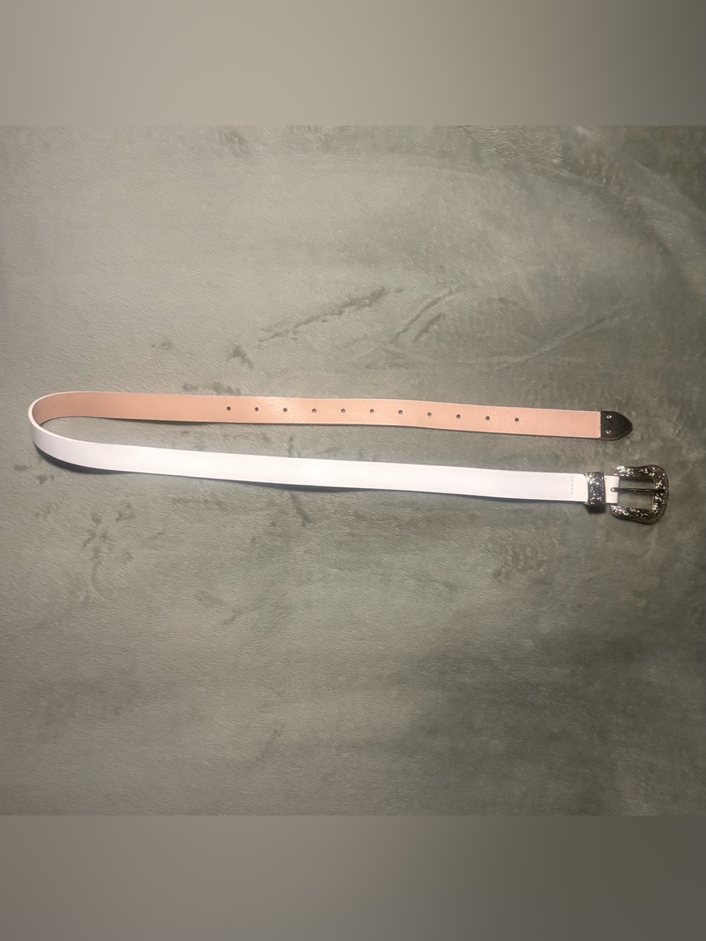 White belt with ornate gold-tone buckle